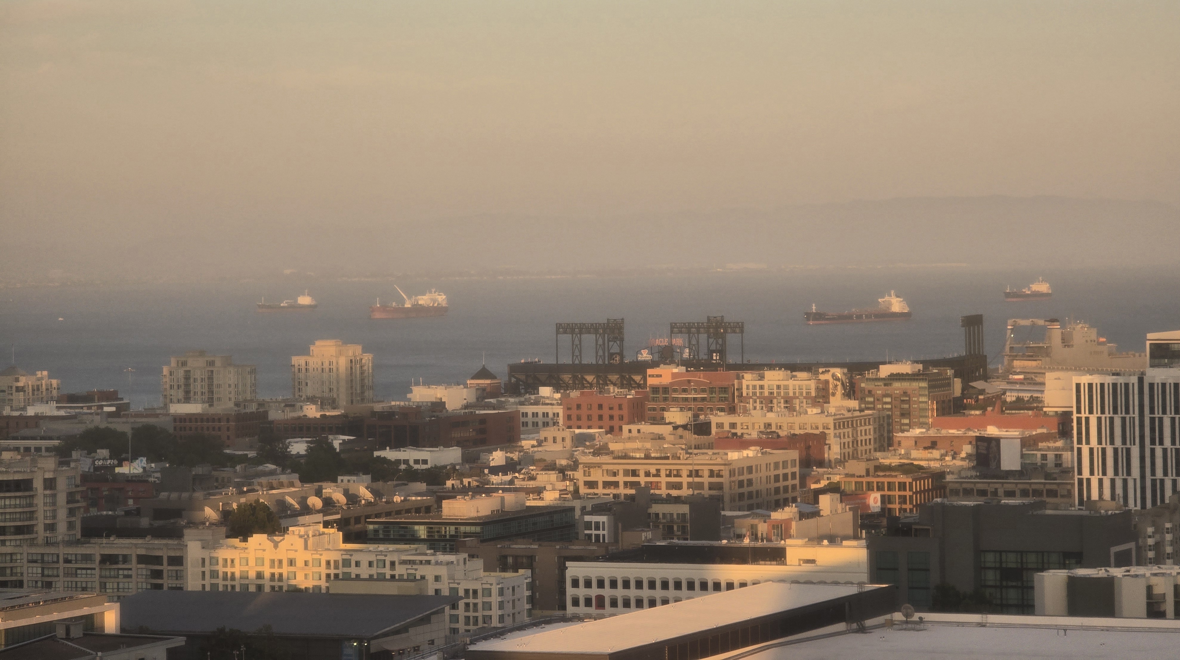 Sunset over the San Francisco Bay and Oracle Park from a high floor