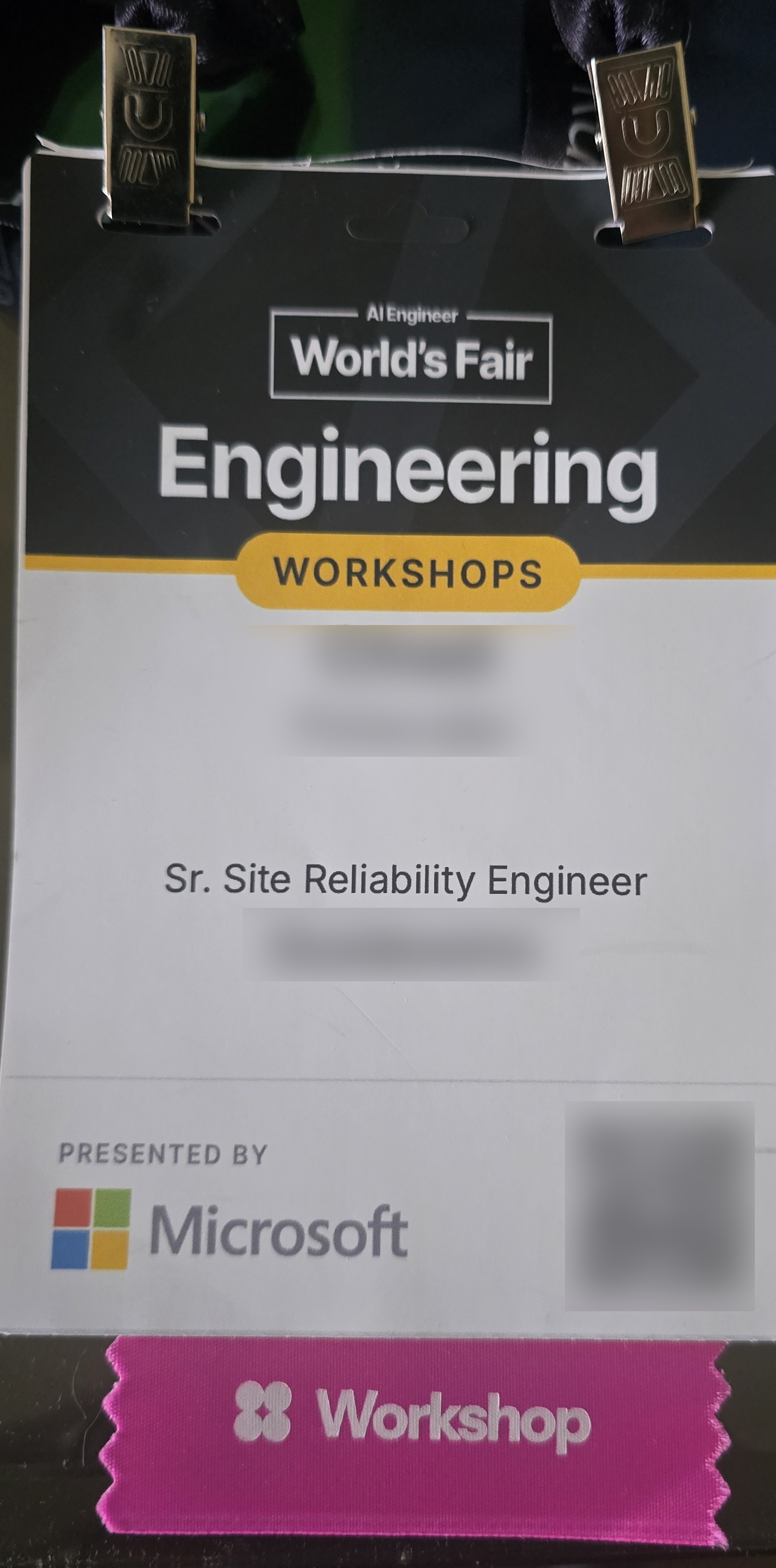 Conference badge, name and company blurred