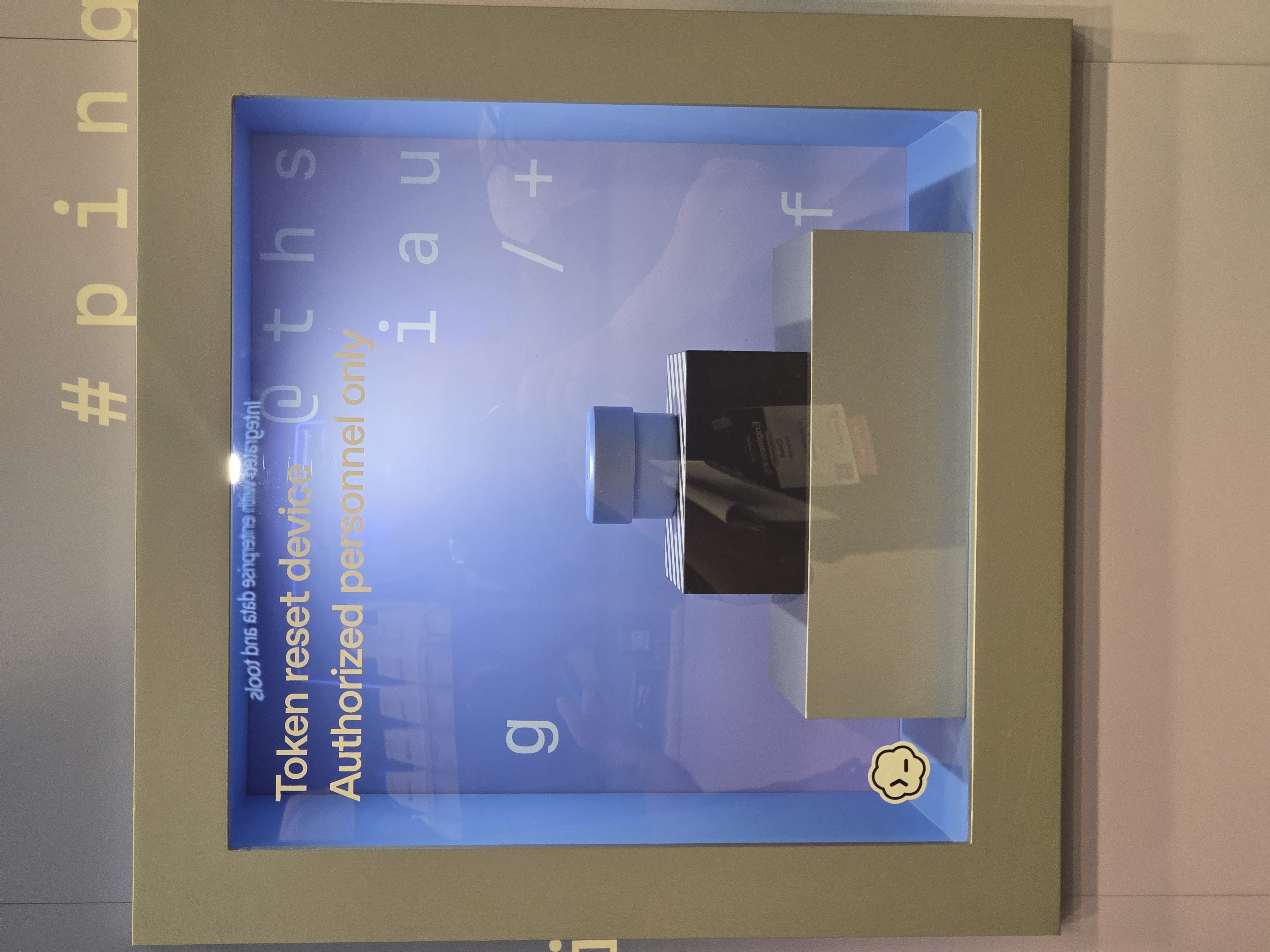 Clerk booth: "Token reset device - Authorized personnel only"
