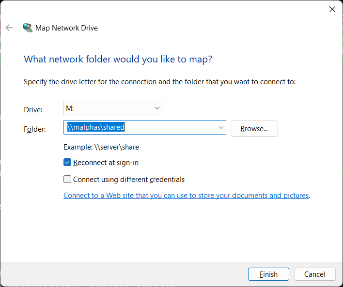 Map Network Drive dialog with folder path and Reconnect at sign-in checked
